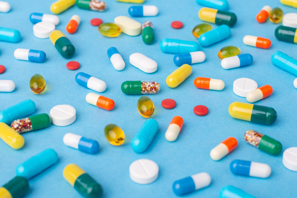 Background of different colorful pills and capsules