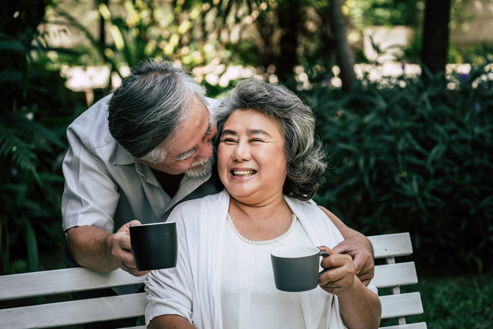Elderly Couples Playing and eating some fruit