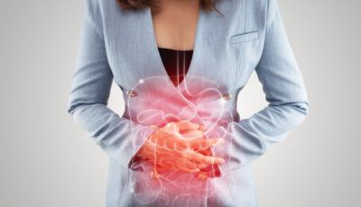 Illustration of internal organs is on the woman's body against the gray