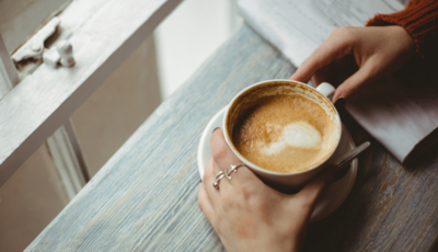 Woman holding coffee cup